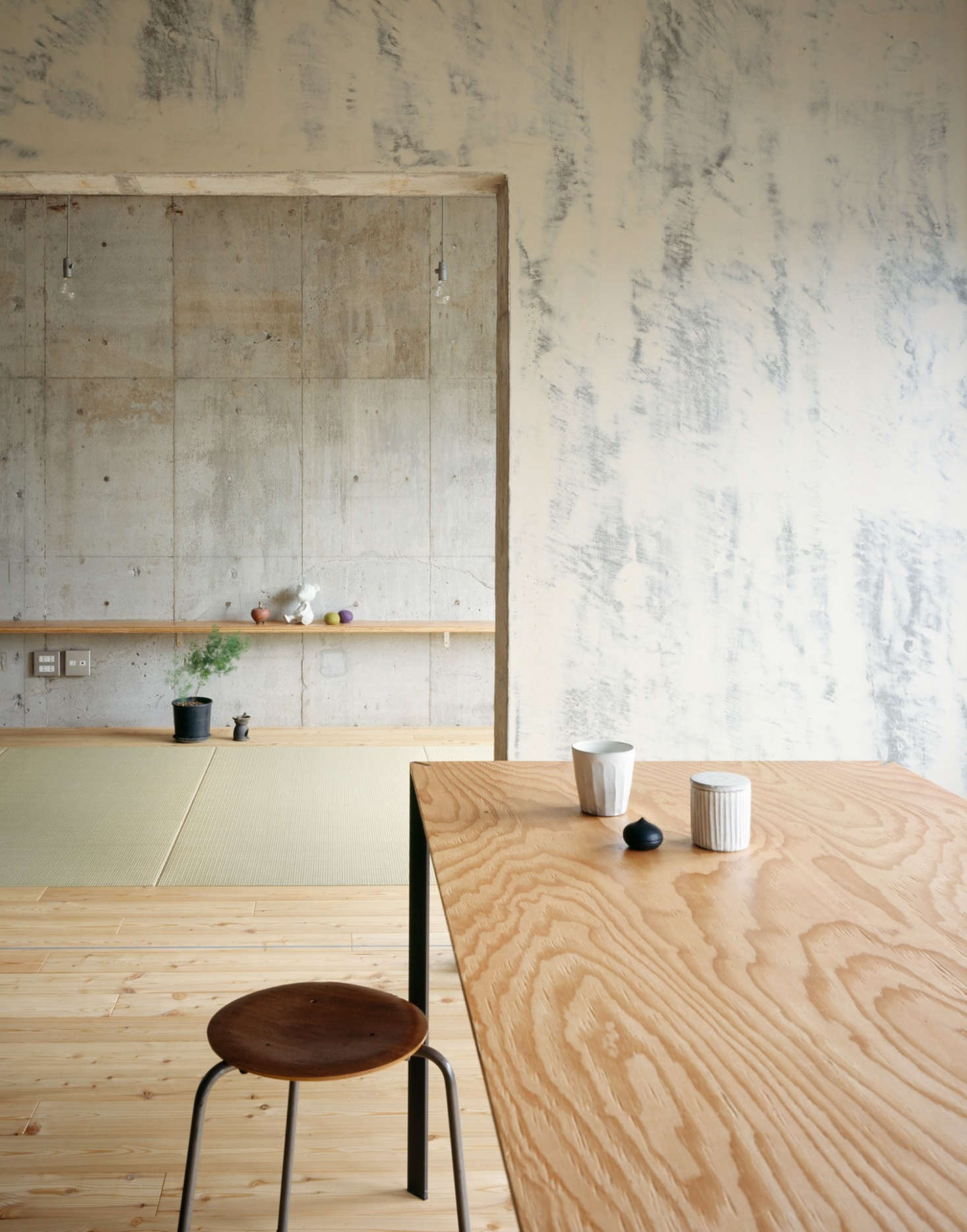 In Setagaya Apartment in Tokyo by Naruse Inokuma Architects, a highly figured plywood panel has been used for a dining room table. Photograph by Masano Nishikawa.