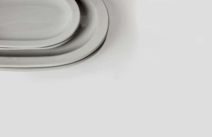 A detail of the platters. The collection is made of heavy, dishwasher-safe stoneware with a pale gray glaze.