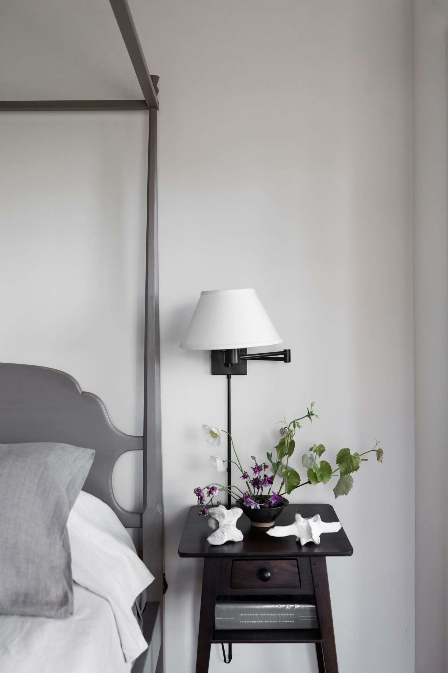 The four-poster bed in the master bedroom is from Windsor Chairmakers in Lincolnville.