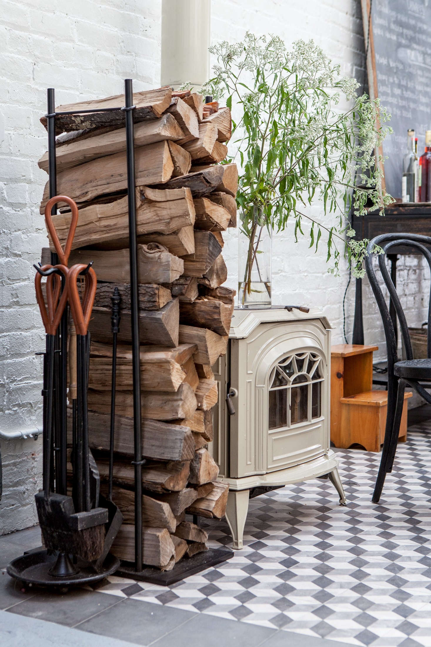 A woodstove, a remnant from the building’s earlier days, warms the dining area.