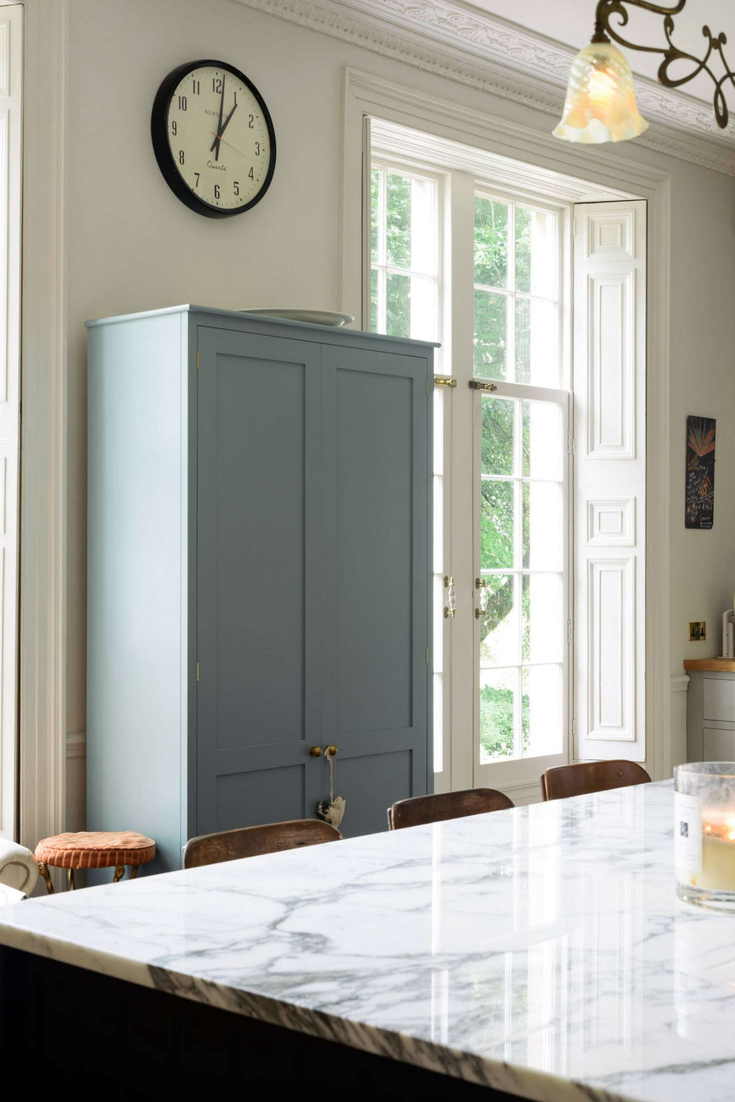 A stand-alone deVOL cabinet, painted in the company’s Trinity Blue, provides extra storage space.