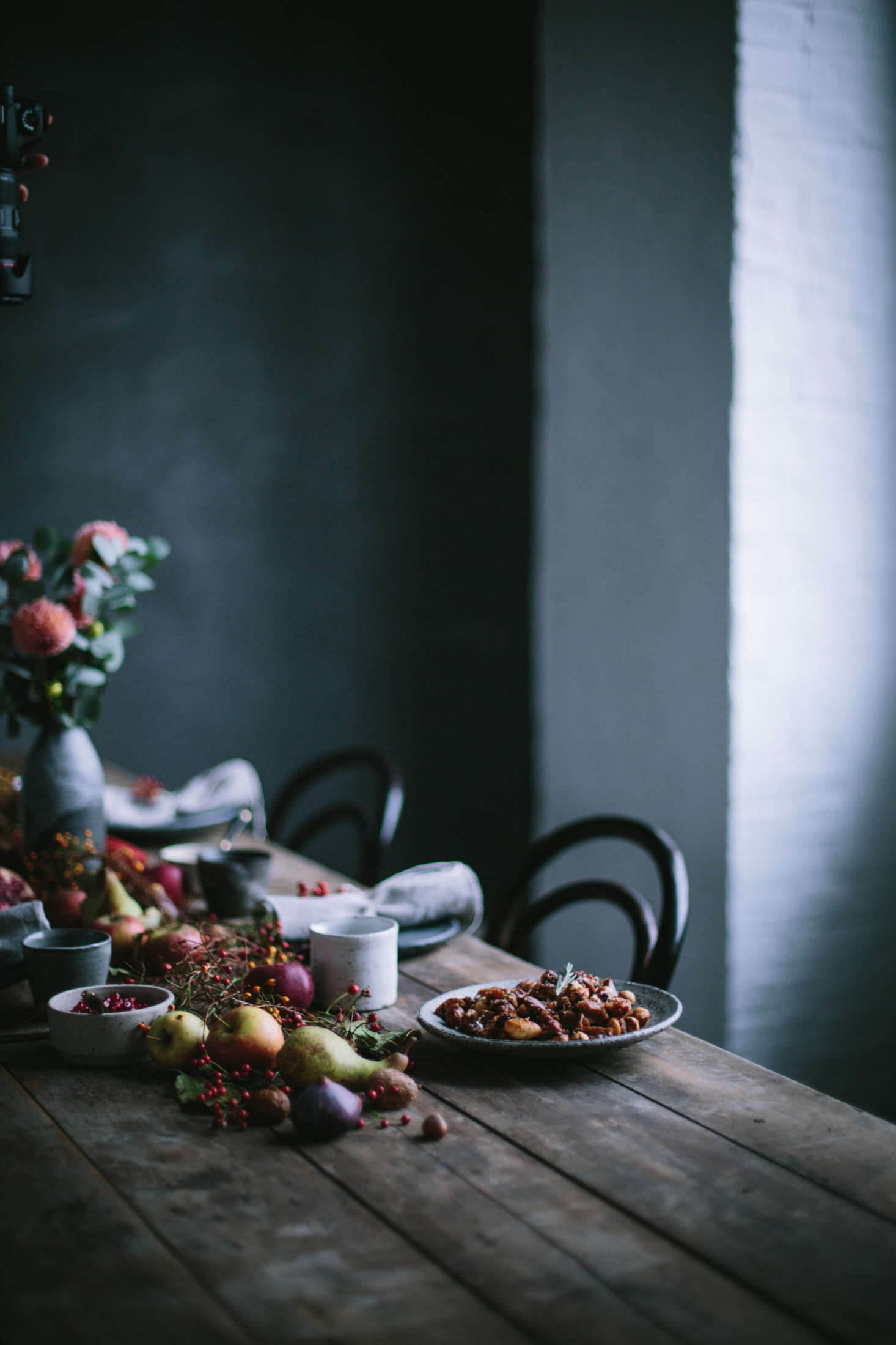 A dark fall tablescape by Flores and Our Food Stories.