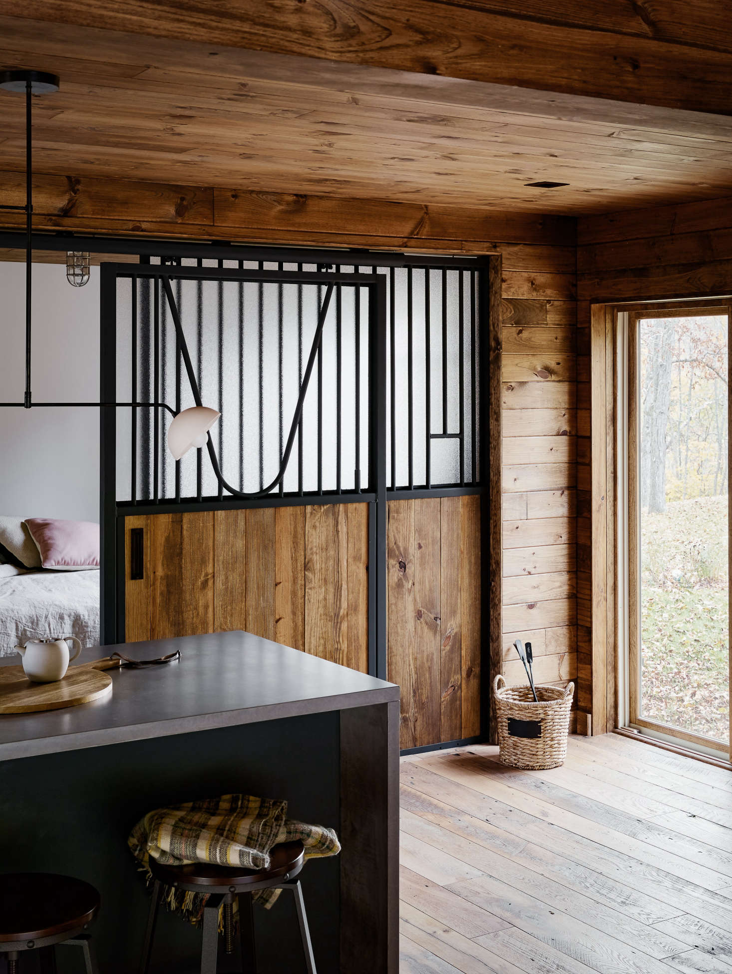The interior walls are stained shiplap pine, and the floors are reclaimed Hit or Miss Oak from LV Wood in New York City.
