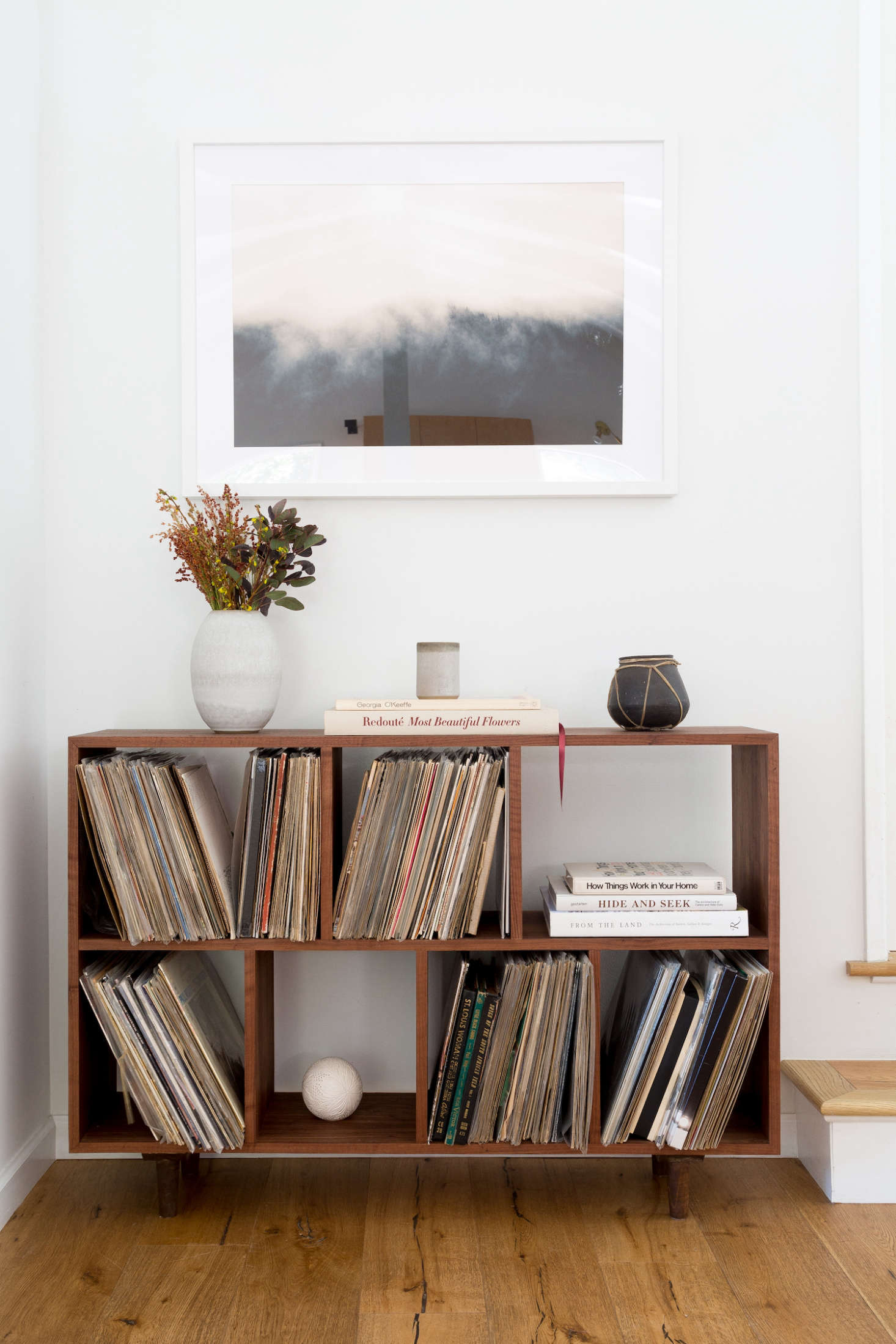 Hunter and her husband have an admirable vinyl collection. The artwork hanging above the bookcase is by photographer Brian Merriam, sourced from online art dealer Tappan.