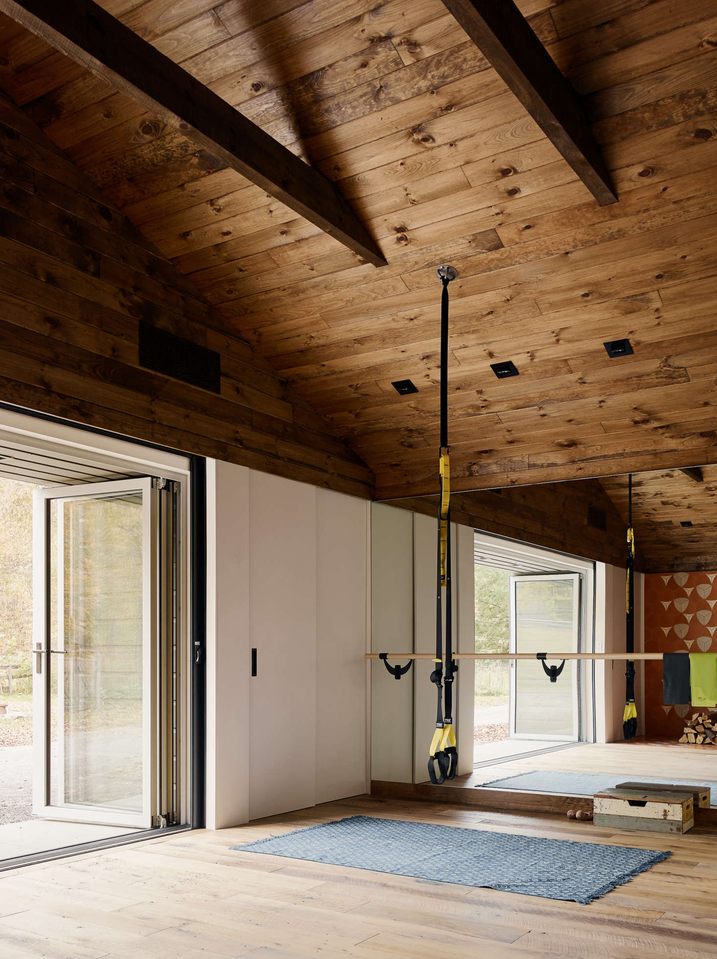 Opposite the woodstove is a workout area with a ballet barre, which gets daily use when the actress is at home.