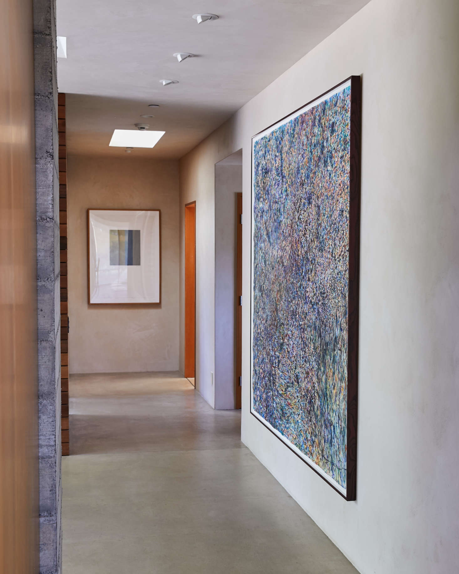A dramatic painting in the foyer anchors the entrance. It