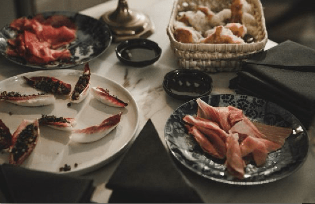 A candlelit dinner on eclectic plates at Sanders Kitchen.