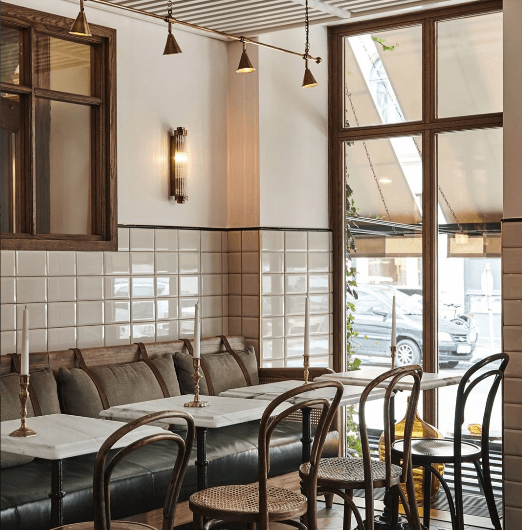 Guests are welcome to eat in Sanders Kitchen or, should they prefer, “under the stars in our rooftop Conservatory, in front of a fireplace on our outdoor terrace, or in your room. Pair it with drinks from Tata , our own beer, or some of the handpicked treasures from our wine cellar.” Here, leather straps affix cushions to the banquette.