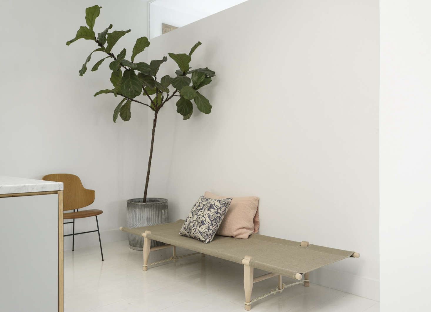The fiddle leaf fig tree stands in an antique French zinc planter (from Fil de Fer in Copenhagen) that was a surprise from Camilla’s mother.