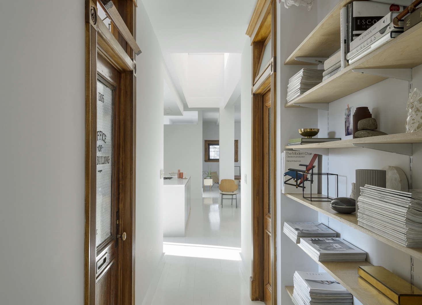 The loft occupies what had been the office floor of the thread factory. Camilla and Peder’s son’s room retains its original frosted glass door.