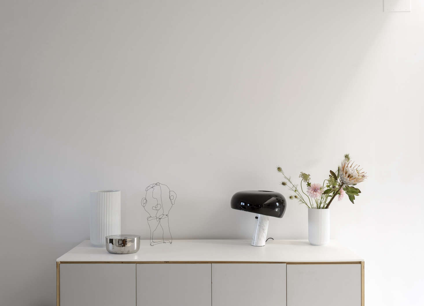 The sideboard, like the kitchen cabinets, is an Ikea hack. It displays fluted Lyngby Vases by Danish porcelain company Lyngby. The wire sculpture is a portrait of Peder by Camilla’s sister, Pernille Vest (@pernille.vest), who is a kindred spirit: She’s an interiors stylist in Copenhagen and a regular contributor to Danish design magazine Rum.