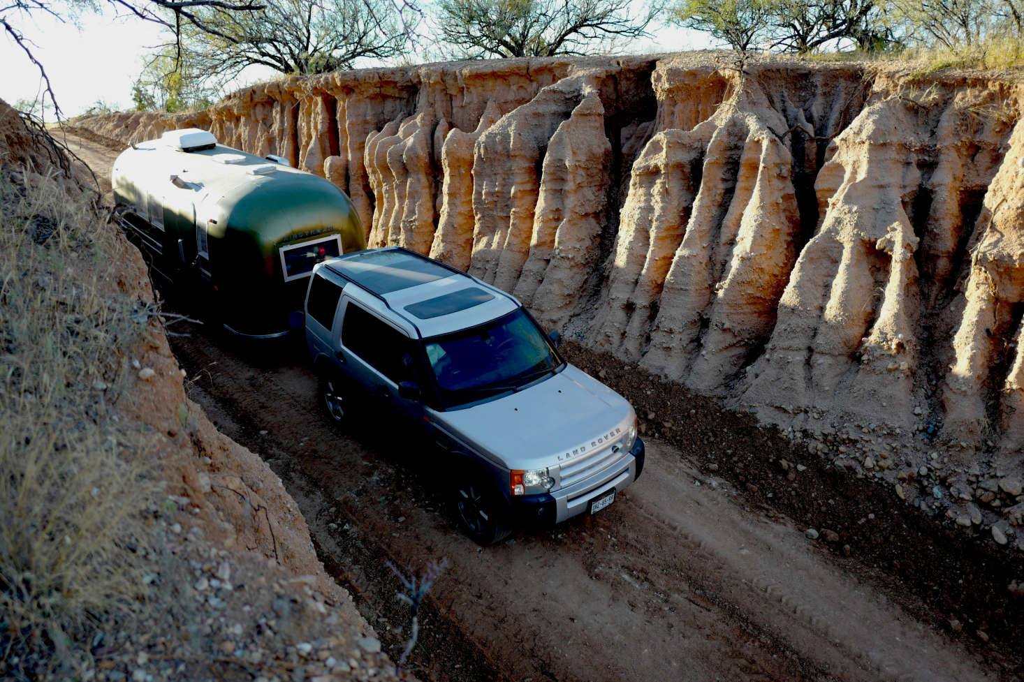 A dramatic eroded gully leads to the Casamidy ranch. The family drives a Land Rover Discovery 3 V-8 that provides crucial extra storage space for on-the-road living.