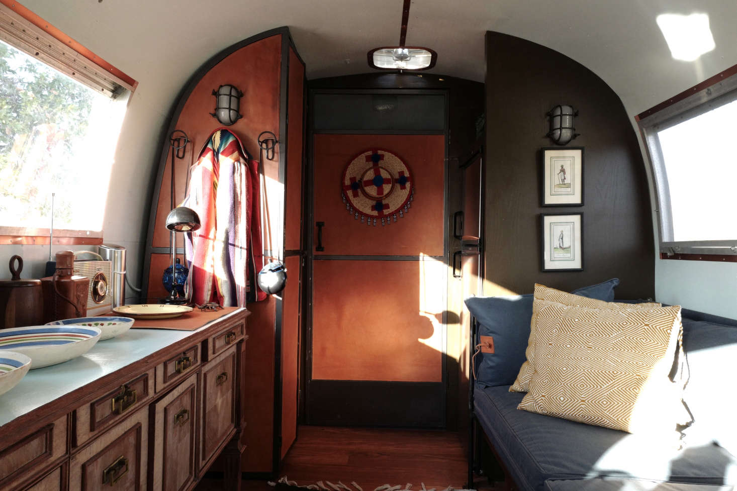 Jorge was about to have a chest of drawers made to extend out from the stove when he discovered this 1970s credenza that came out of a fancy Mexican law office. “It’s fifty-six inches long and was to the inch the perfect size. Also the eleven-inch feet fit exactly in the wheel wells underneath, and the drawers lock, which you need so they don’t fly open when you’re driving.”