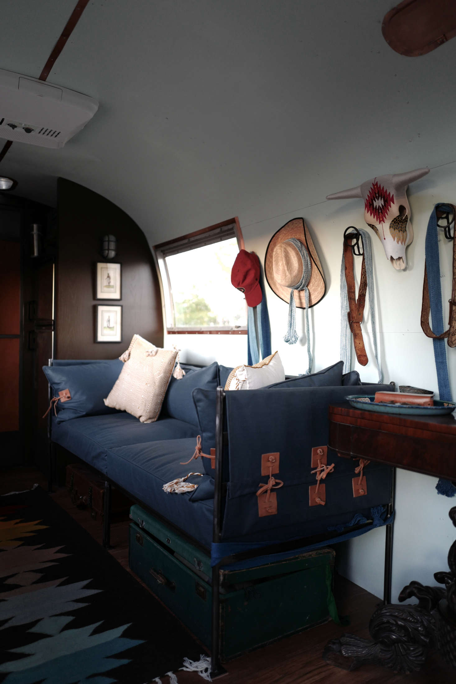 The sofas are detailed with saddle leather; this one is 30 inches wide and the other is 35 inches wide.
