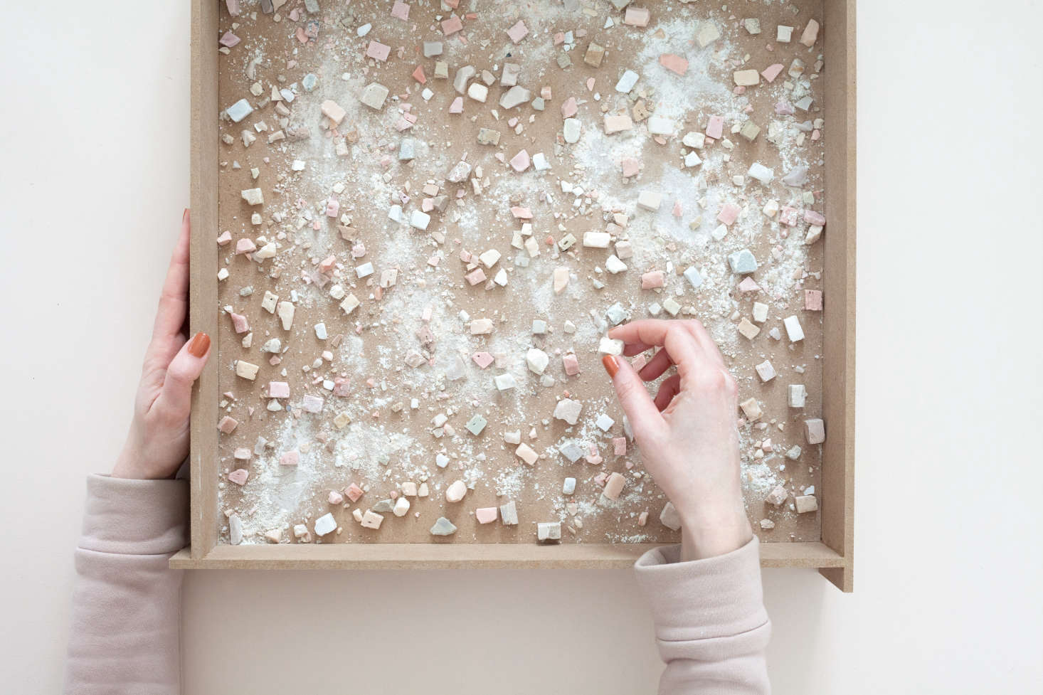 The tile fragments are evenly sprinkled over the tray and also mixed into “the dough.”