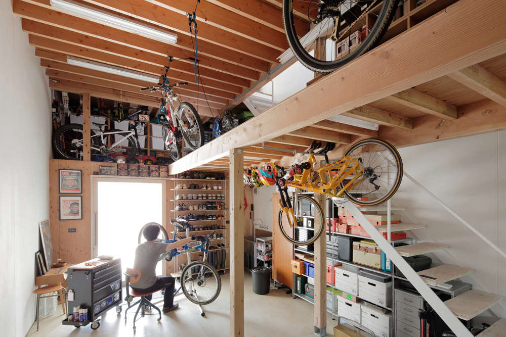 The product designer’s workshop is right off the front door. Bikes are hoisted to the storage loft by Rad Bike Lifts; $22.37 via Amazon.