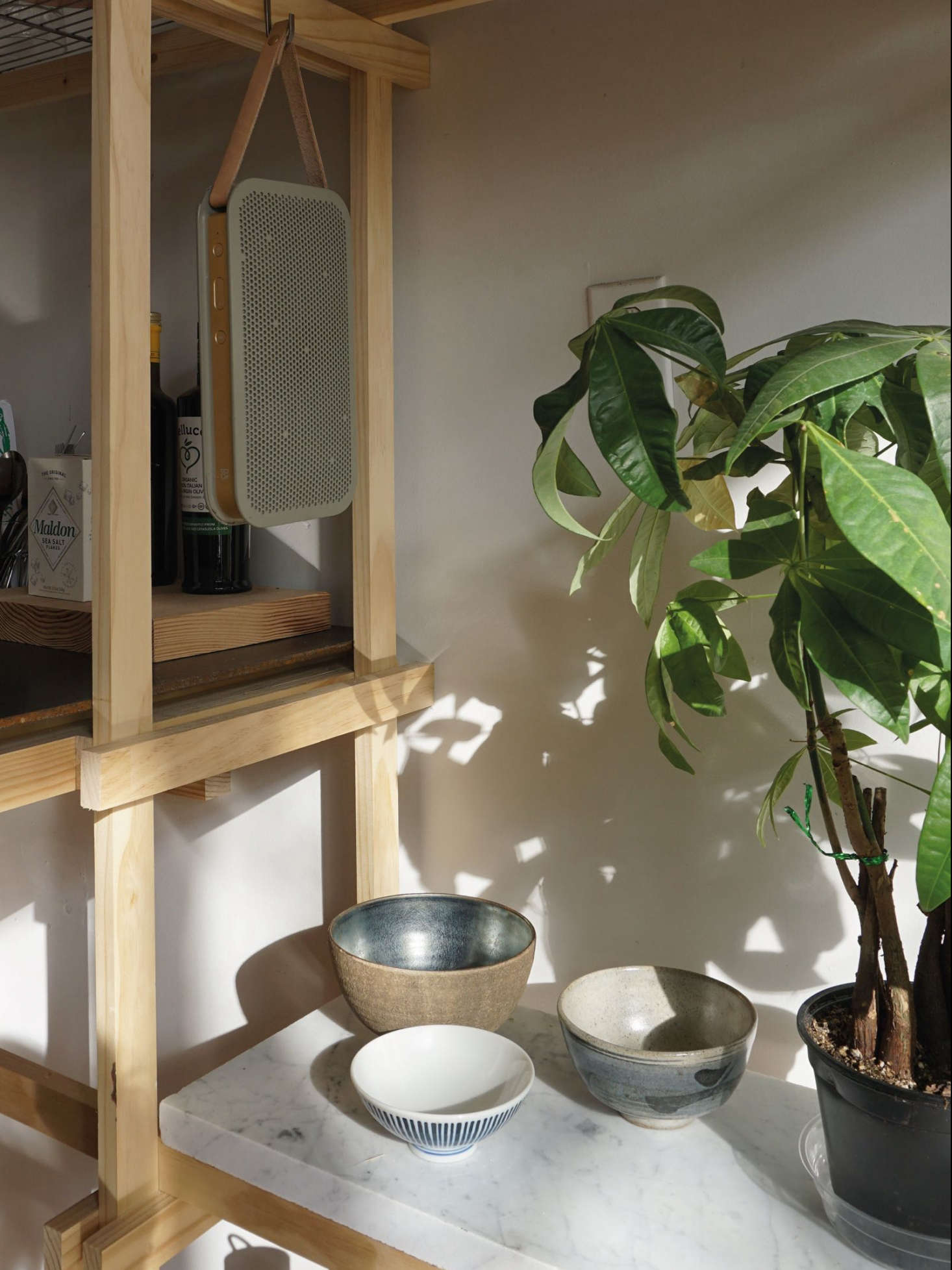 Another marble hack in Kristina Line’s DIY Bushwick apartment: Discarded marble pieces fit onto a simple timber frame to create an ever-changeable, multipurpose shelving system (that looks more expensive than it is).