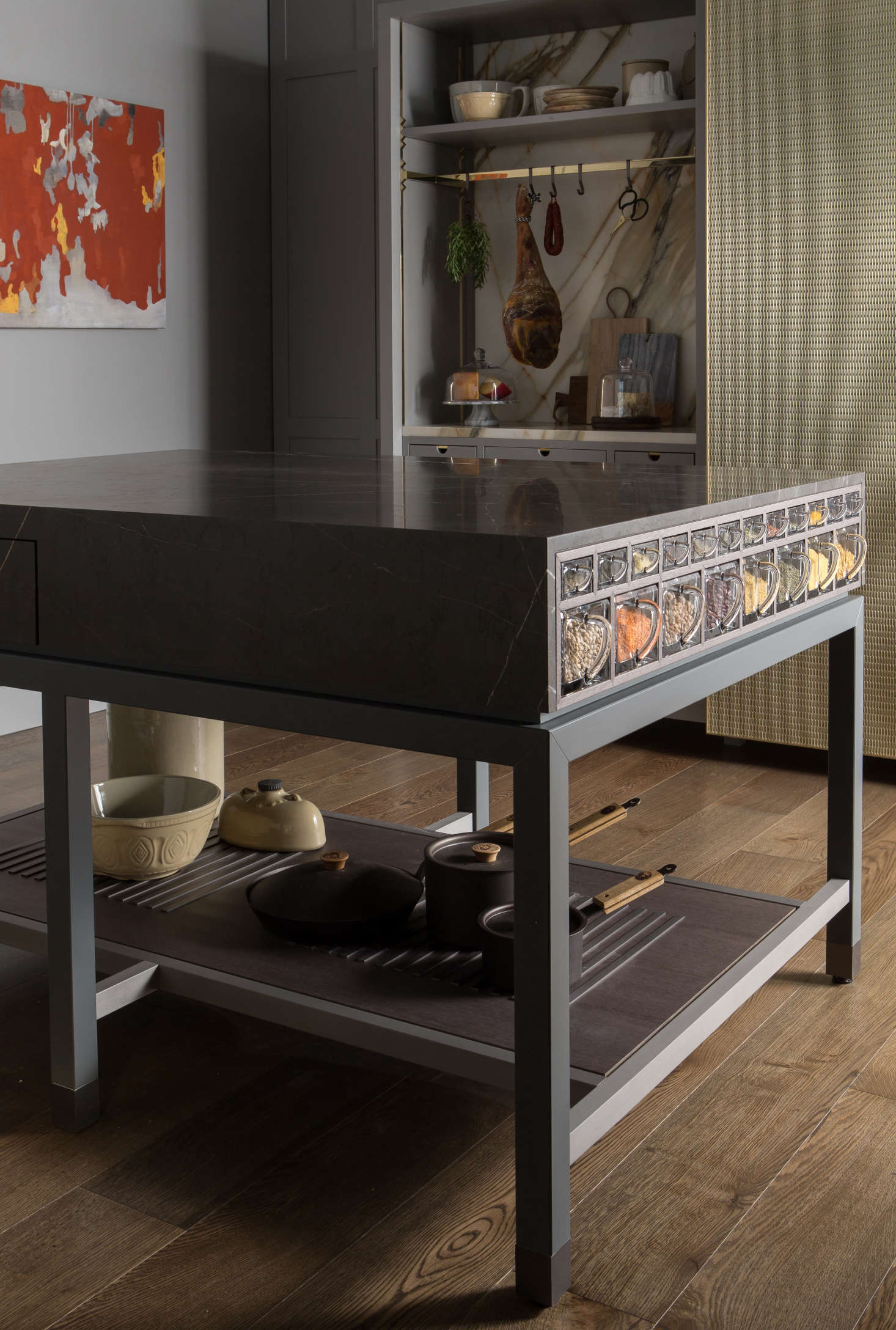 Known as the Scullery Table, a red marble preparation island is kitted out with crystal spice drawers in two sizes. Made from 1920s German molds with pour spouts, the drawers are for regularly used dry foods (they’re not airtight, but can be put in a humidity-controlled pantry) and are backlit by a hidden LED panel that makes the contents glow.