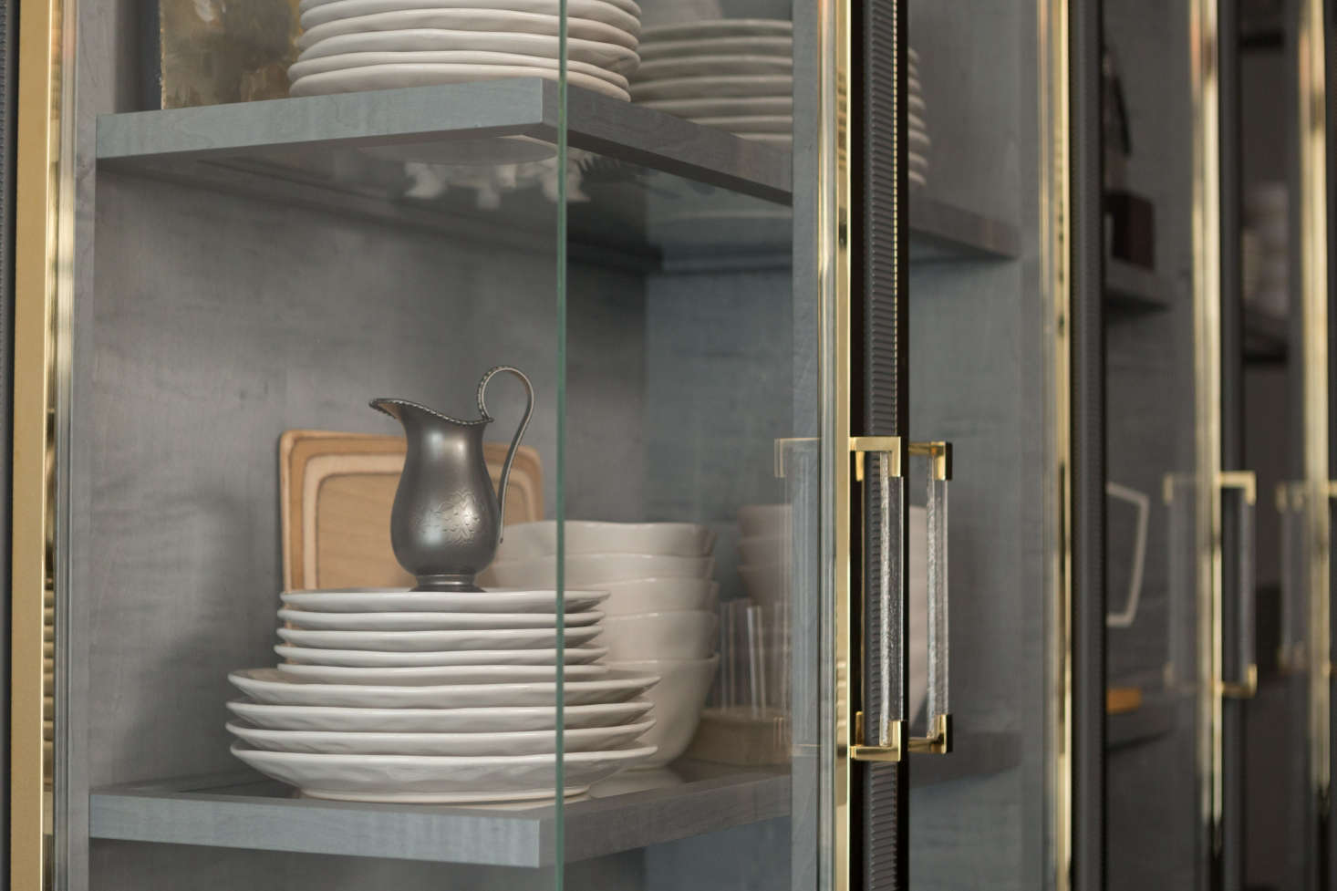 One of the kitchen’s references to John Tradescant, the botanist and collector, is its cabinet-of-curiosities-inspired vitrine with glass corners and a gray interior of stained sycamore.