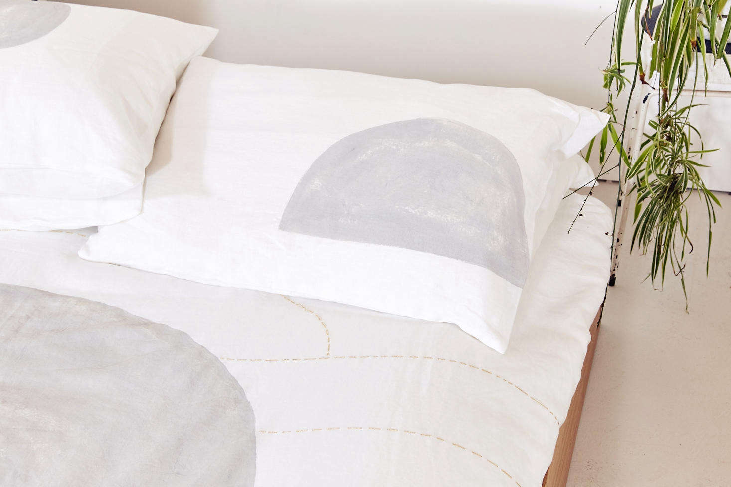 To add dimension, Vallentine finishes some of the duvets with subtle gold embroidery that she hand stitches herself.