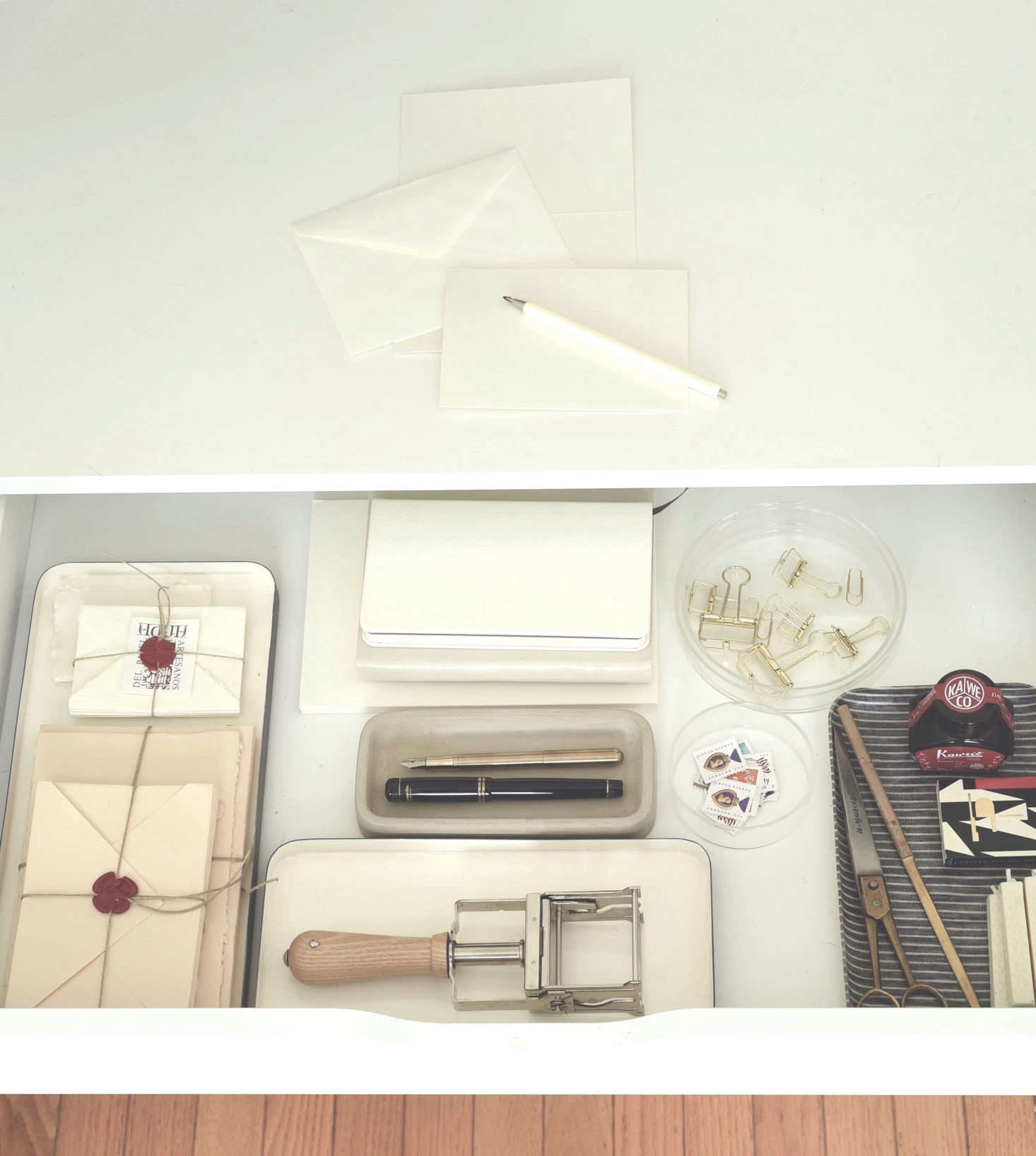 If the kitchen is your workspace, clear out a drawer and create space inside for your office essentials: a laptop, pens, paperclips, a tray for papers, and whatever else you need. Pull out your supplies during the day (maybe even work at the counter; it