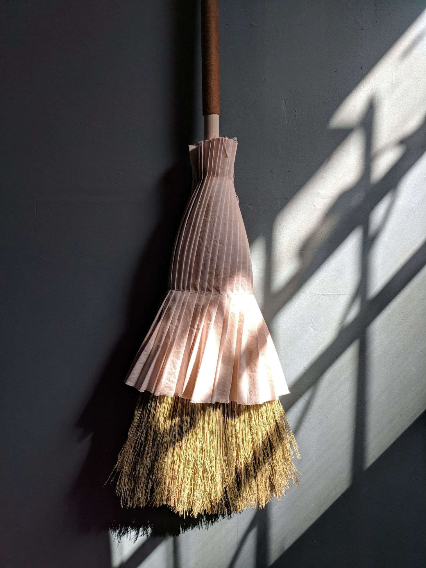 The pleated skirt is made of rose/lavender dyed linen. “I like to go to Pratt Library on the weekends and look at textile books; that’s how I came up with the idea of adding a pleated, hand-dyed organic linen cover, almost like a skirt.”