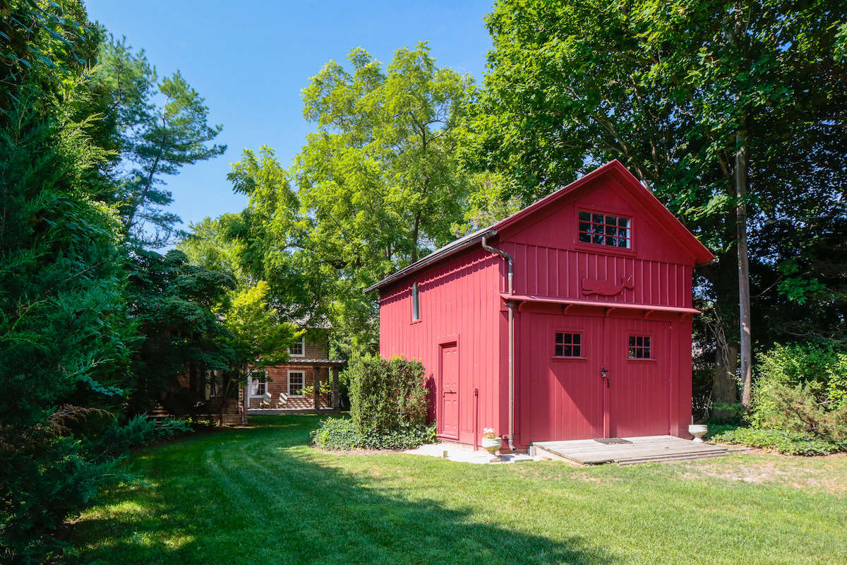 The red barn at the front of the house has extra beds for guests.