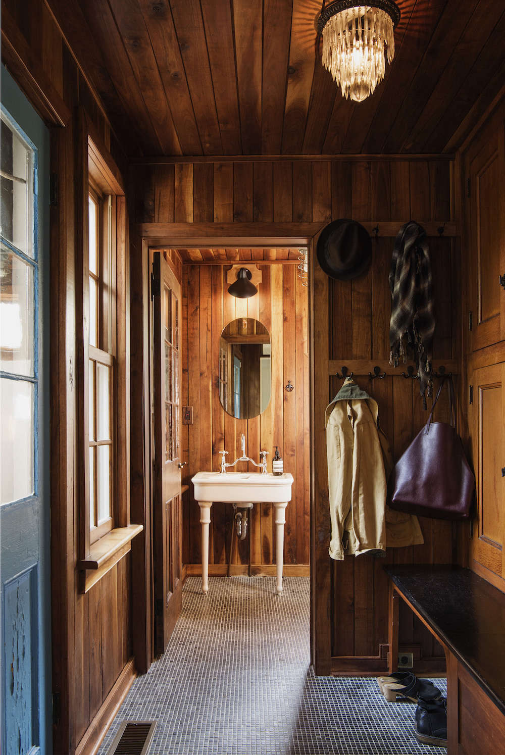 The entryway is lined in the same salvaged oak as the kitchen.