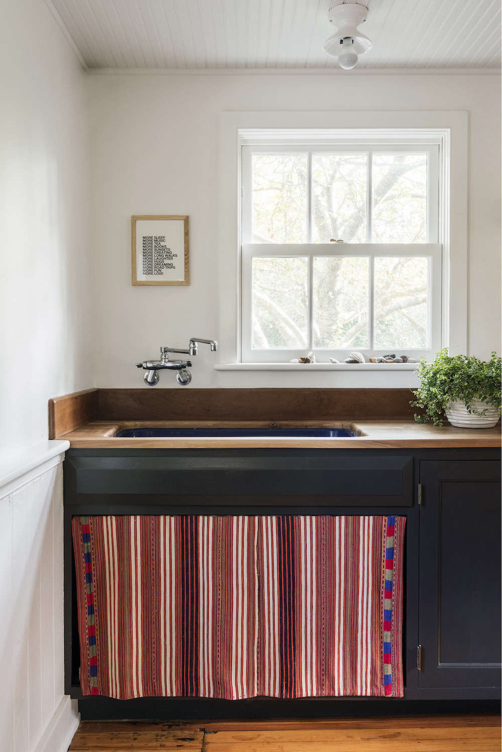 Elizabeth had a sink skirt sewn from a vintage Guatemalan textile.