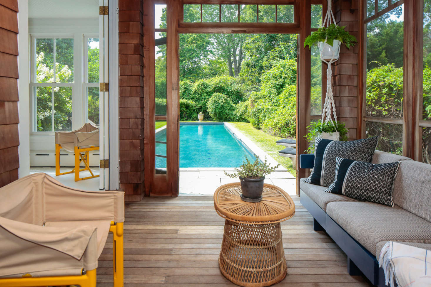 The sun porch opens onto the pool and back yard.