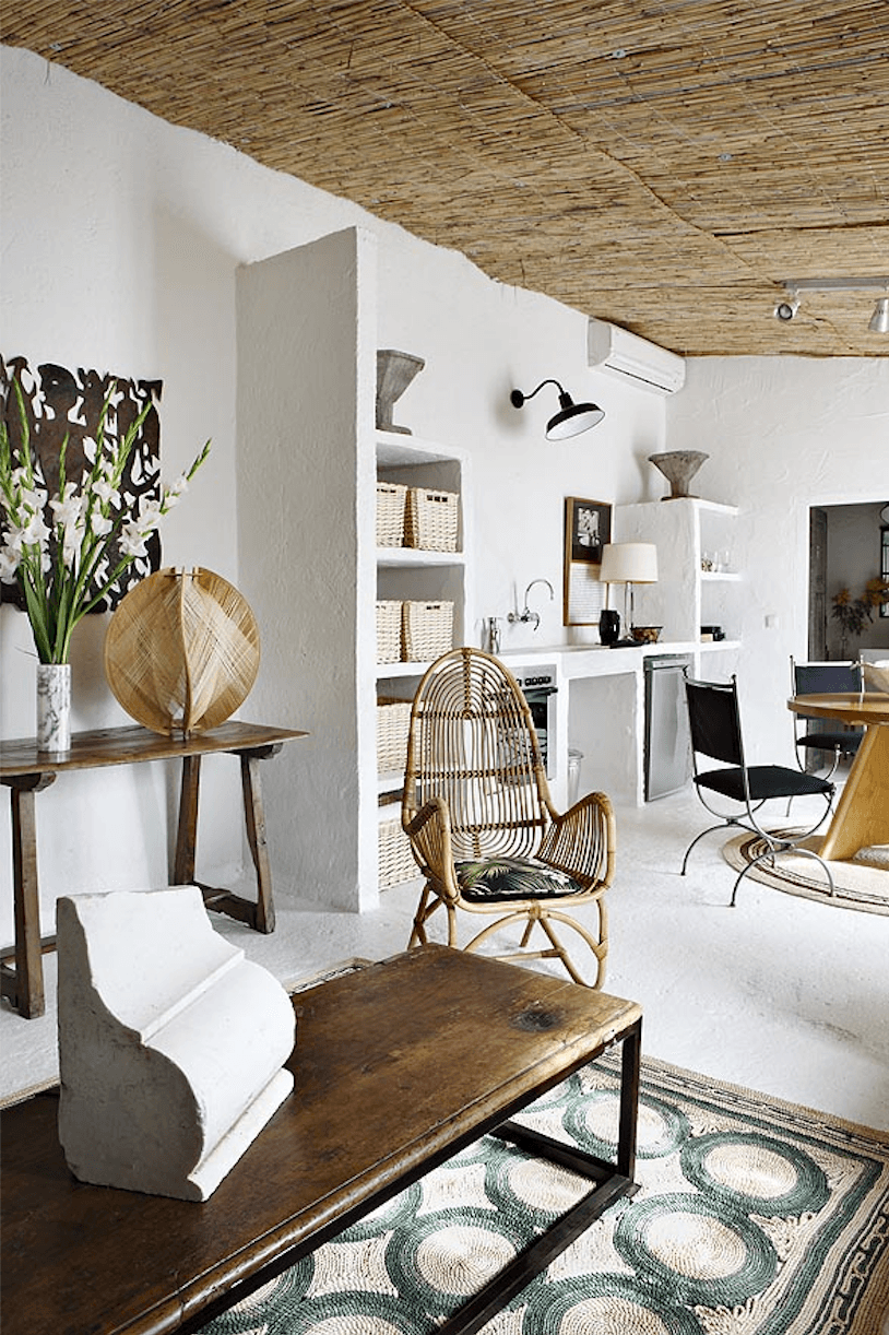 Castella and Flinn also wanted the young couple’s guests to feel “autonomous and at home on the Mediterranean sea.” A crucial element: adding a kitchen. “We designed everything,” the designers say, building out stucco shelving and a simple stretch of counter along one wall. “We brought in an antique marble sink to give that ‘forever’ effect, while using state-of-the-art appliances, like the stovetop and fridge,” they say.