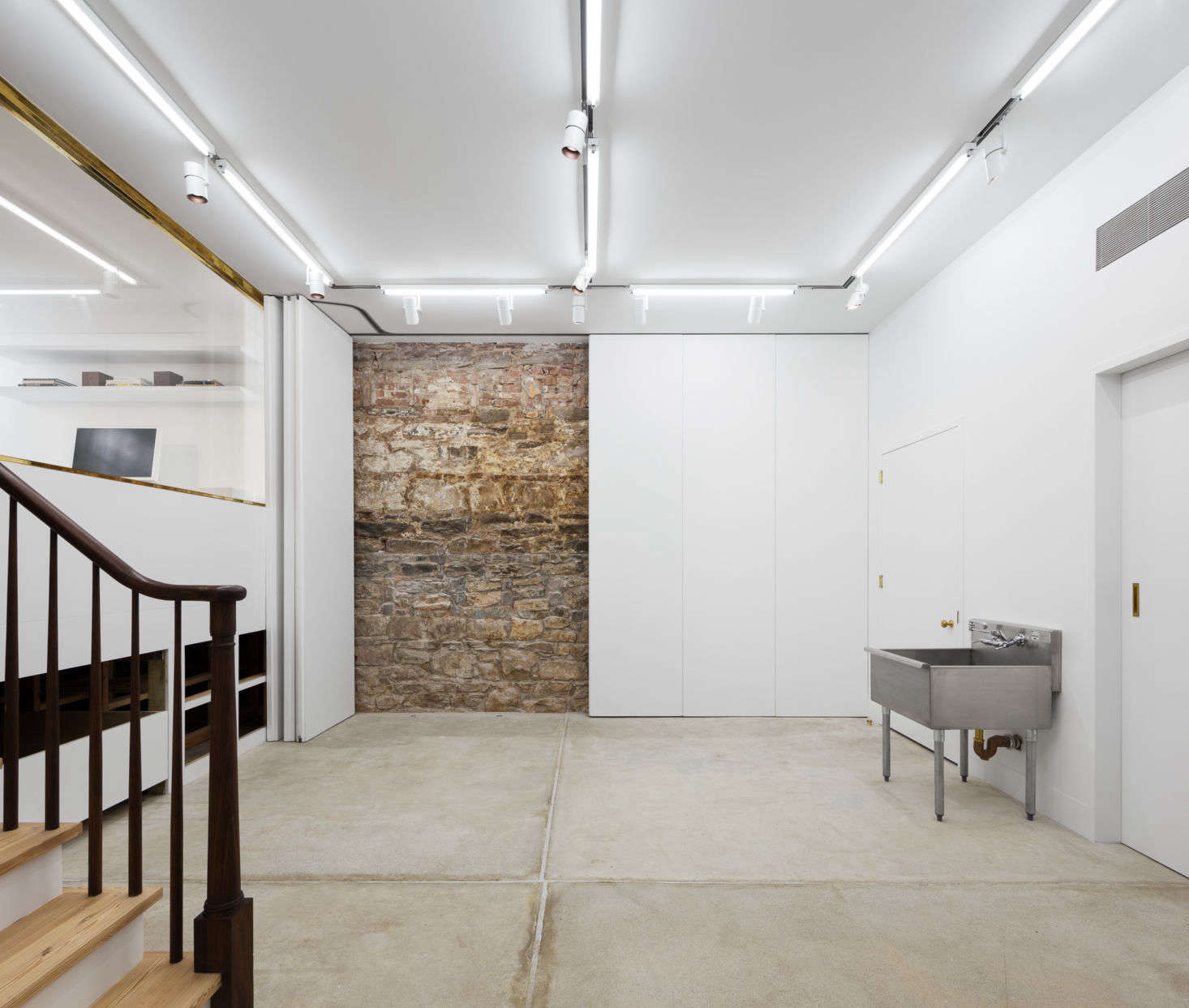 A simple but spotless basement, as seen in Layers of History—and Color—in an Artist Couple’s 1828 Manhattan Townhouse. Photography by Devon Banks, courtesy of Yun Architecture.