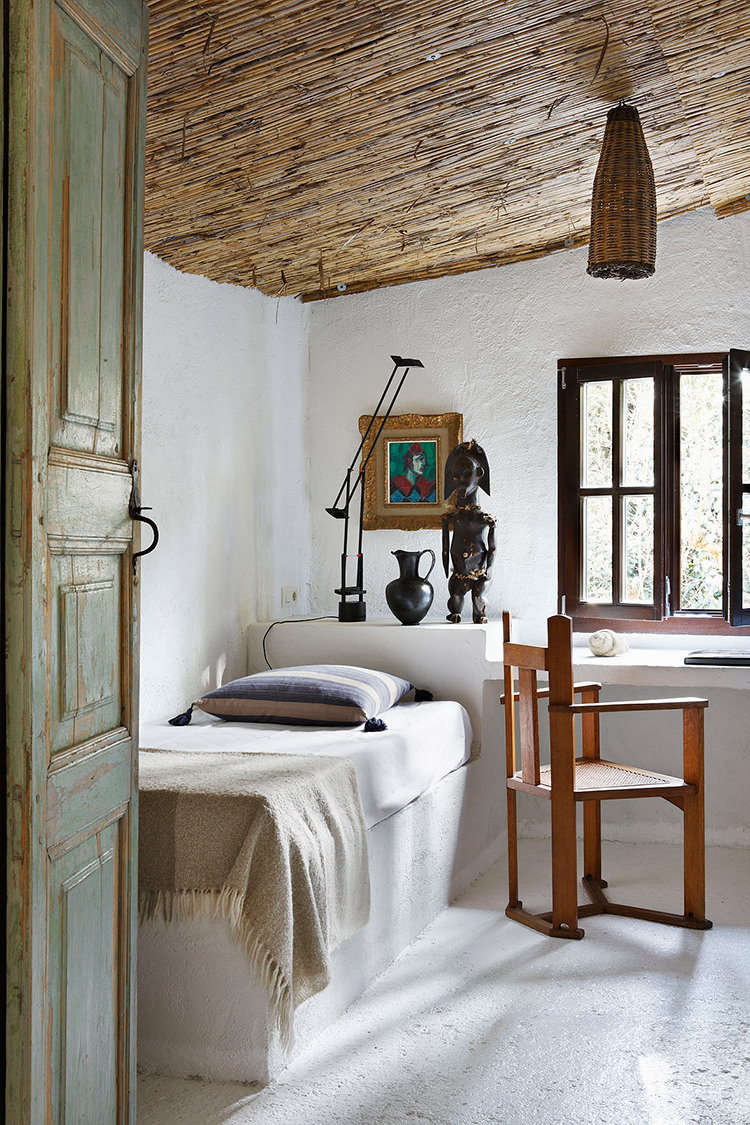 Beds are made simply, with light blankets and tasseled pillows.