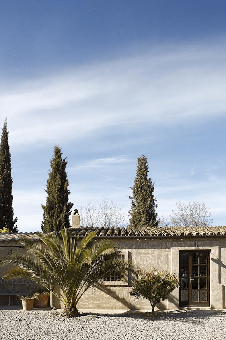 The lush exterior of the stables turned guest house.