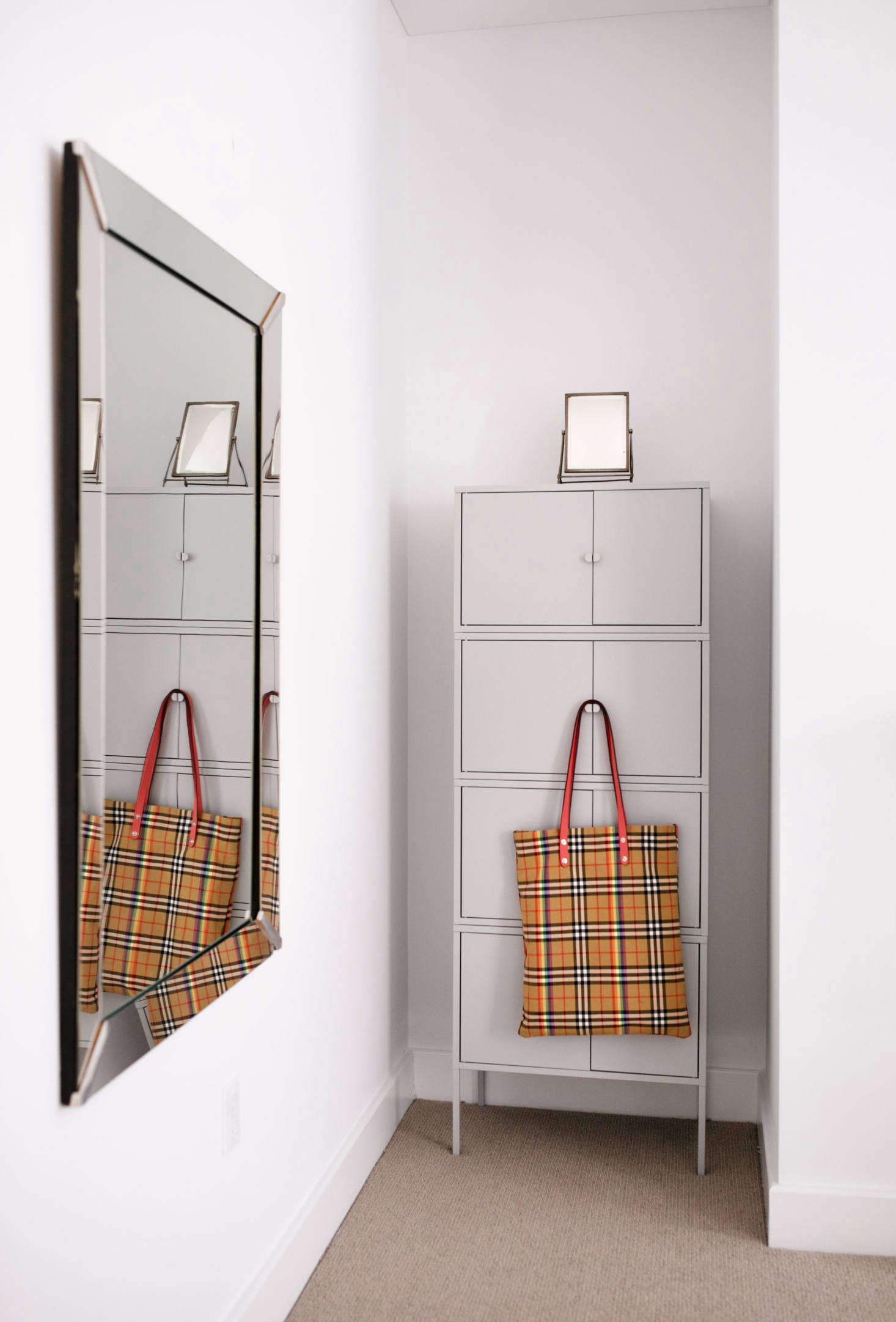 A mesh Burberry bag provides a dash of color.