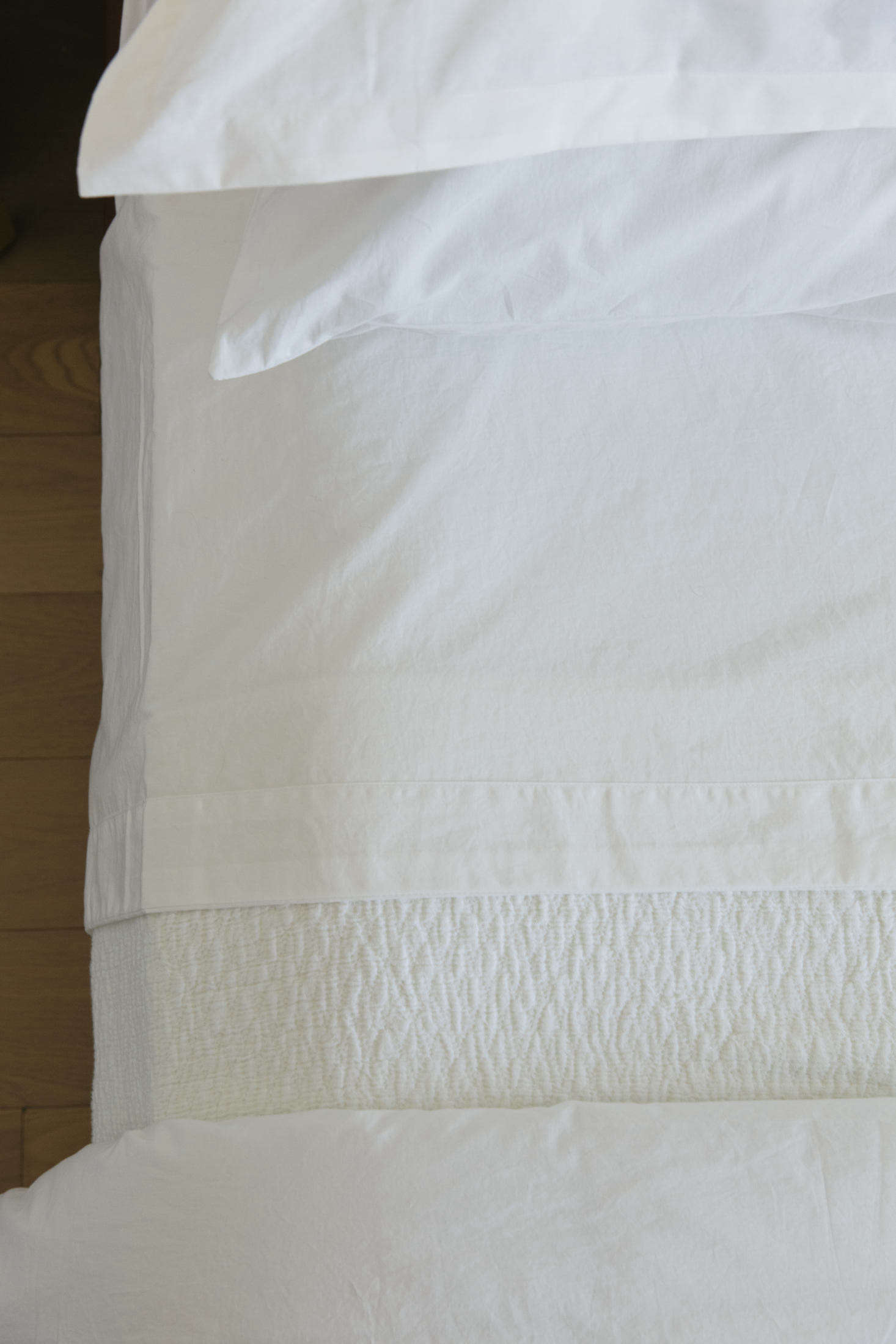 The subtle texture of the white-on-white layers.