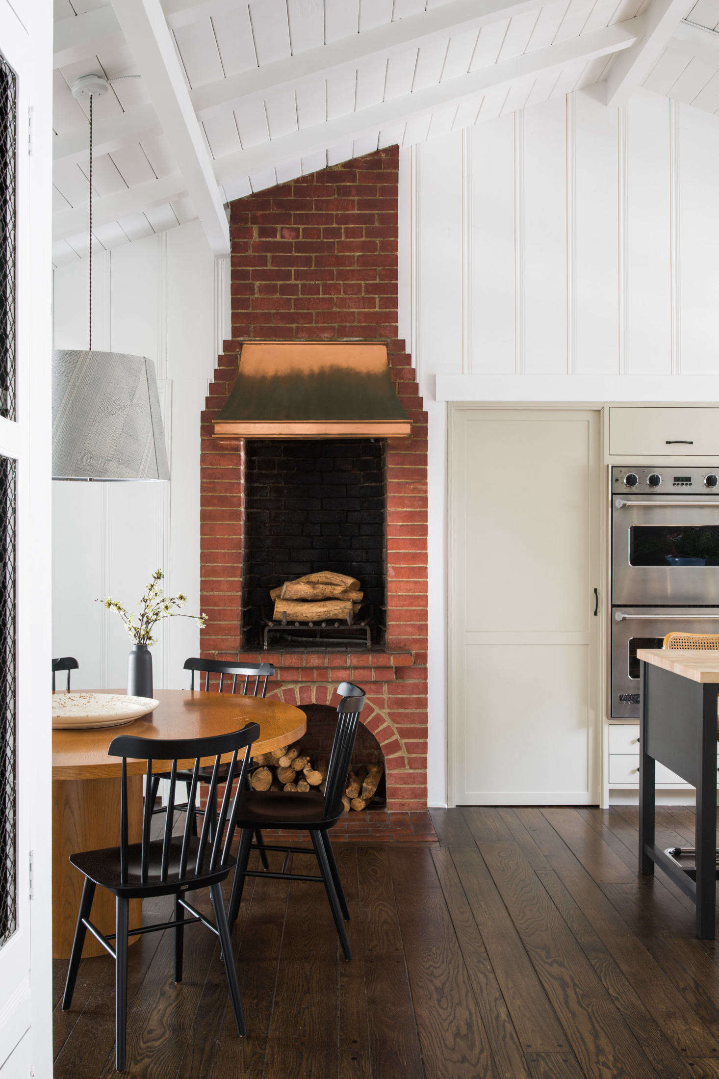The kitchen now opens into a small dining room.