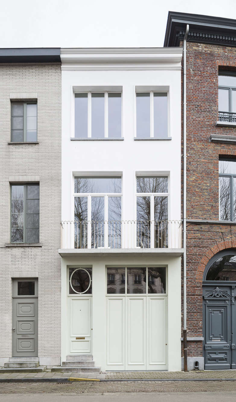 “The house was originally part of the house to the left of it,” as you face it, the architects say. They broke down and rebuilt the house in stages so that the interior structures still acted as scaffolding for the houses beside.