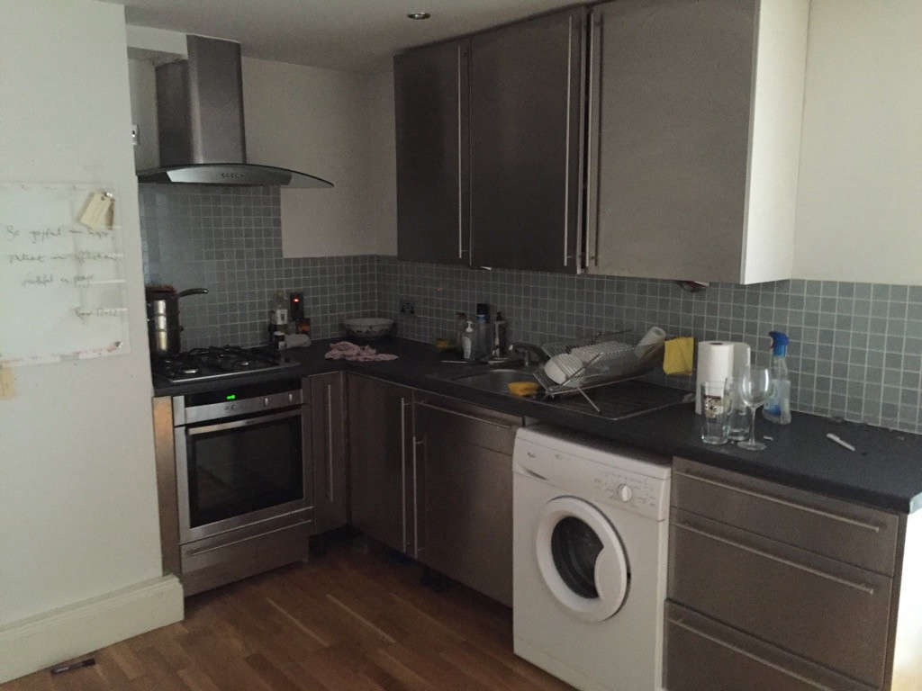 The dark kitchen, before. Photograph courtesy of Hutch Design.