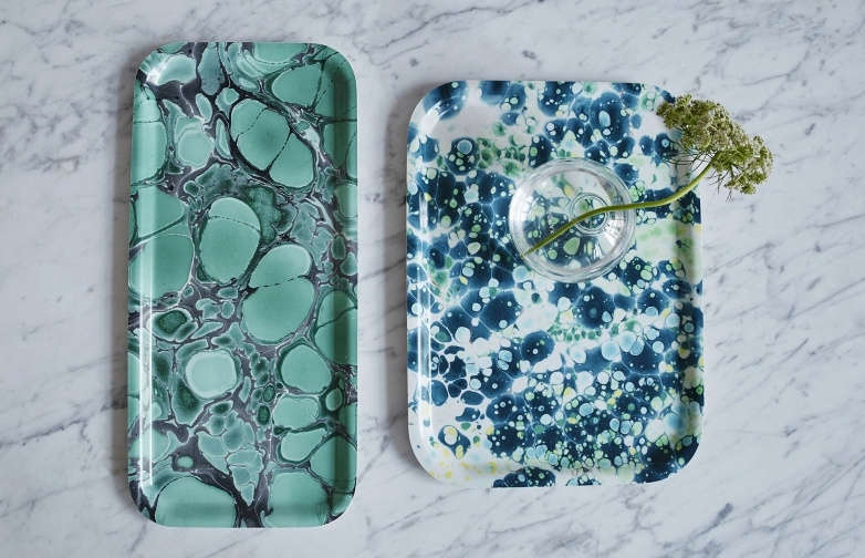 At left, the birch veneer Deep Jade Cocktail Tray is 9. KR (approximately $ USD). At right, the birch veneer Aqua Breakfast Tray is also 9. KR.