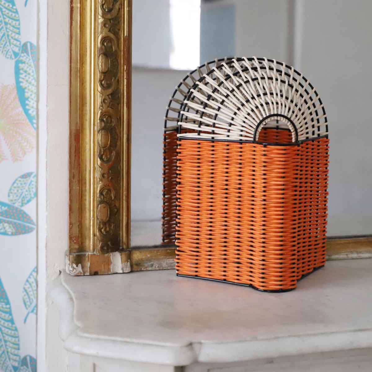 The Paon Small Lamp in Coral and Natural Rattan is €249.