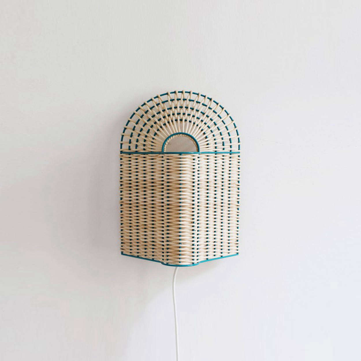 The Paon Small Lamp in Natural Rattan with green lacquered metal is €249.