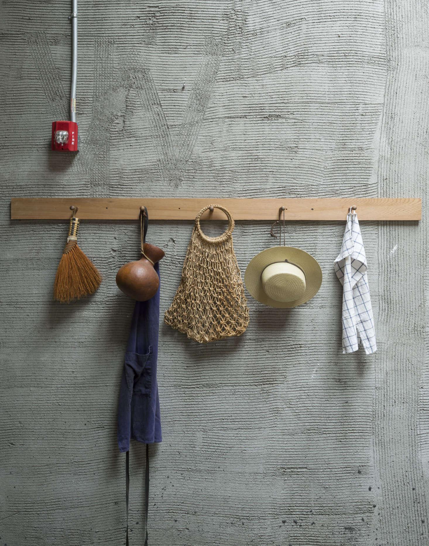 The Shaker rail is made from a cedar board with pegs from the hardware store.