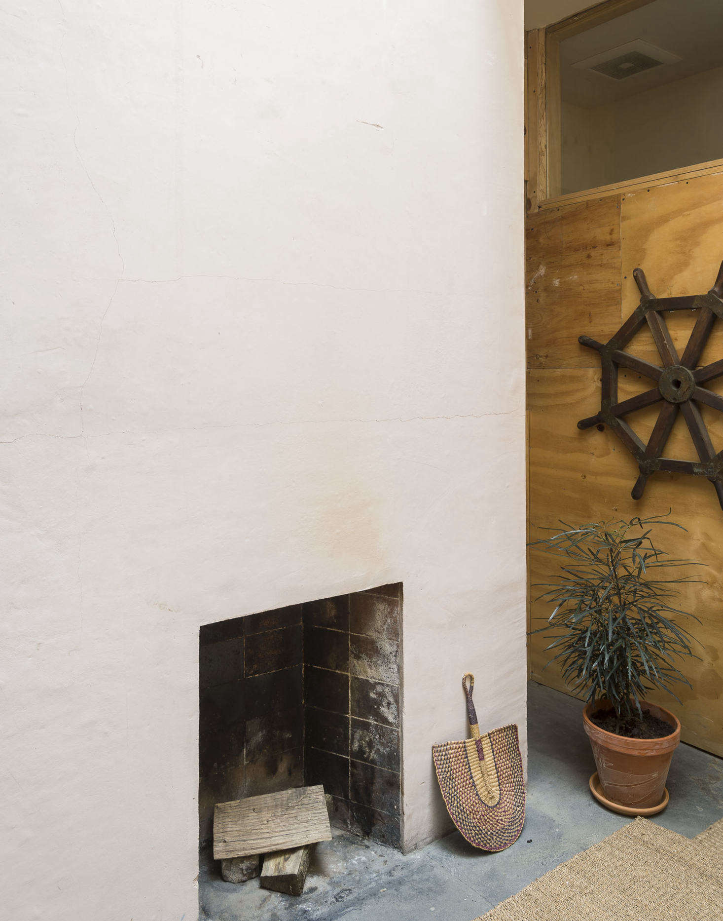The wall-mounted nautical steering wheel belonged to Bretaigne’s father, who was a Coast Guard captain based in Okinawa during WWII.