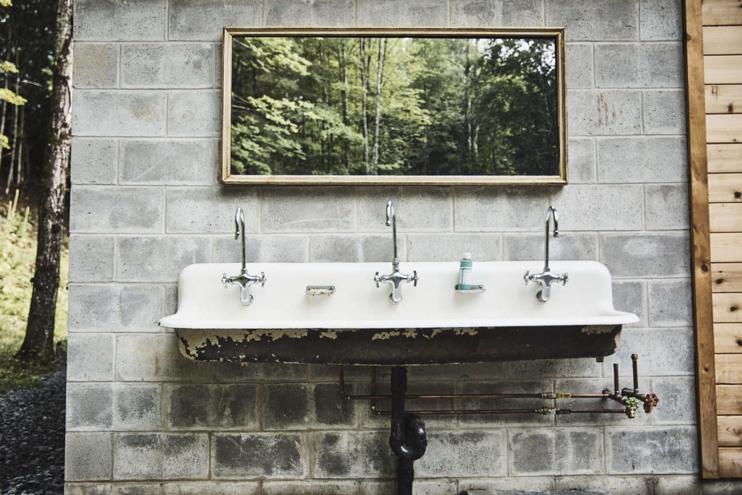 Another Aesthetic Movement touch: A vintage communal sink outside The Mess and a mirror positioned to capture the landscape.