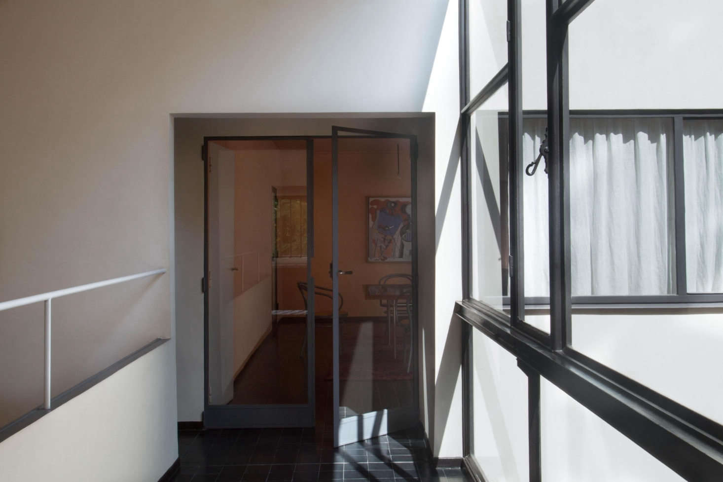 Glass doors lead into the dining room.