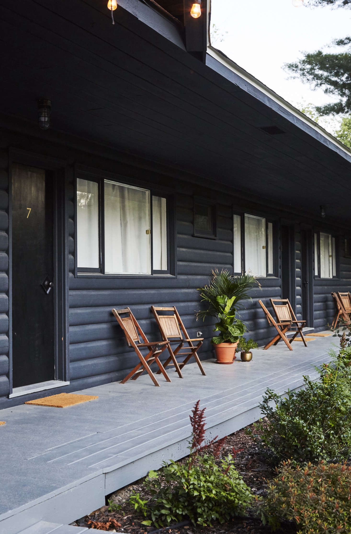 The wooden folding chairs on the porch are original to the lodge.