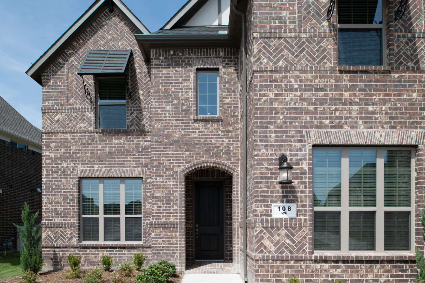 A Texas home sports dark brick in several bond patterns. Photograph courtesy of the Brick Industry Association.
