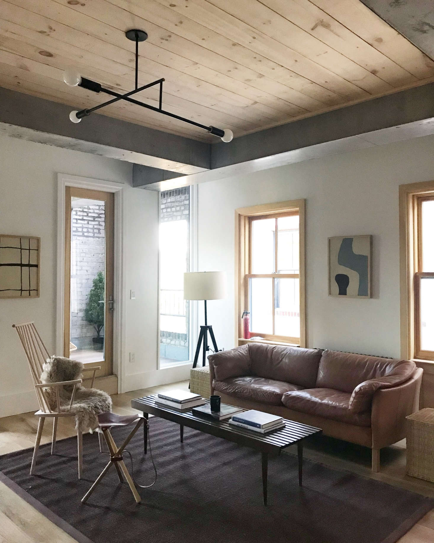 For the Hoveys, abstract canvases are the essential finishing element that lends nuance and soul. Hollister paints these herself—often with the exact space in mind. The two examples shown here are in the living room at 5th & Green, an ongoing project of four townhouses in Greenwood Heights renovated by Fabr Studio & Workshop.