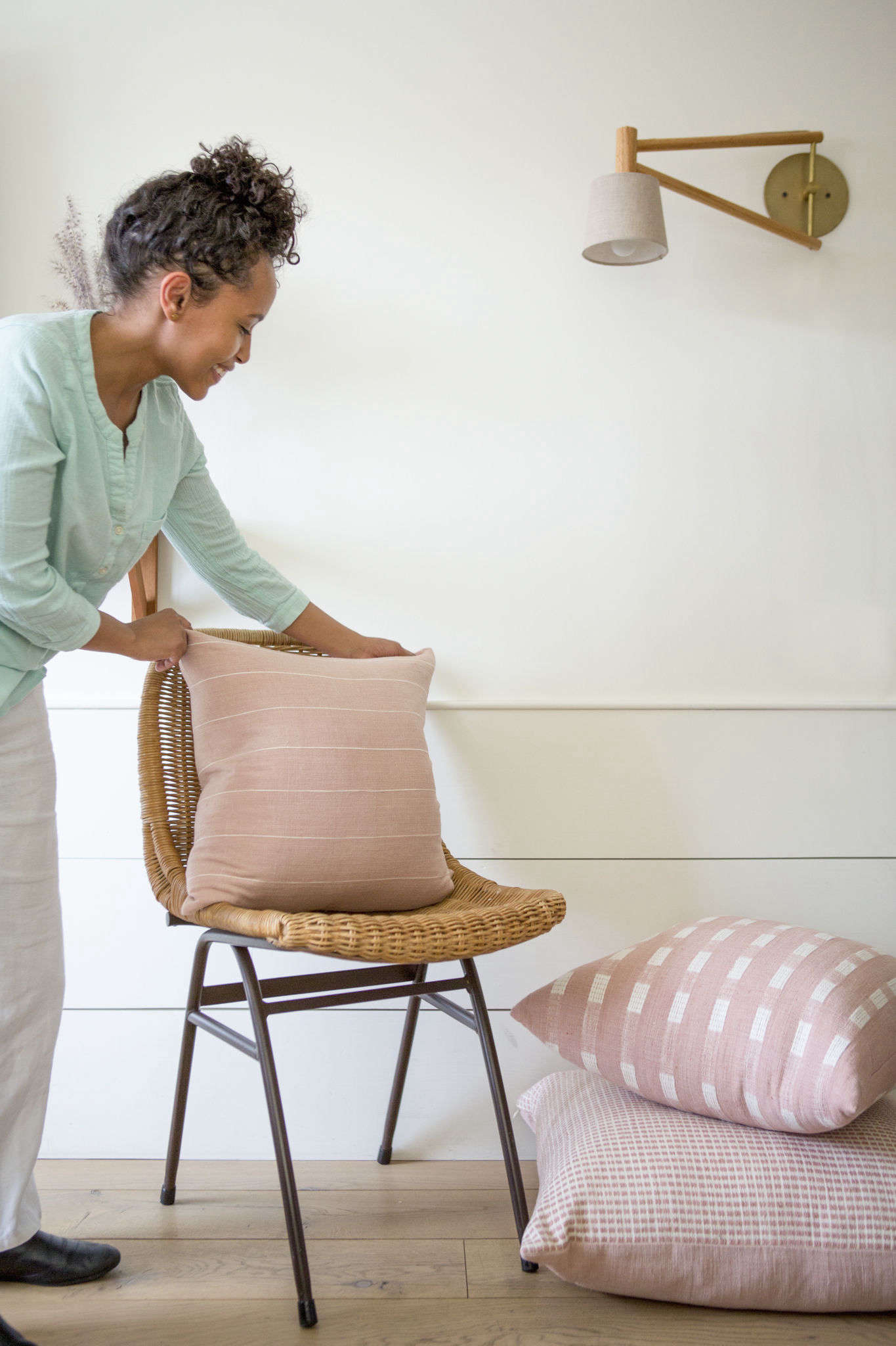Hana styling some pillows for a shoot. New this year on the site, selected Bolé Road textiles, in both regular and upholstery weight, are available for purchase by the yard.
